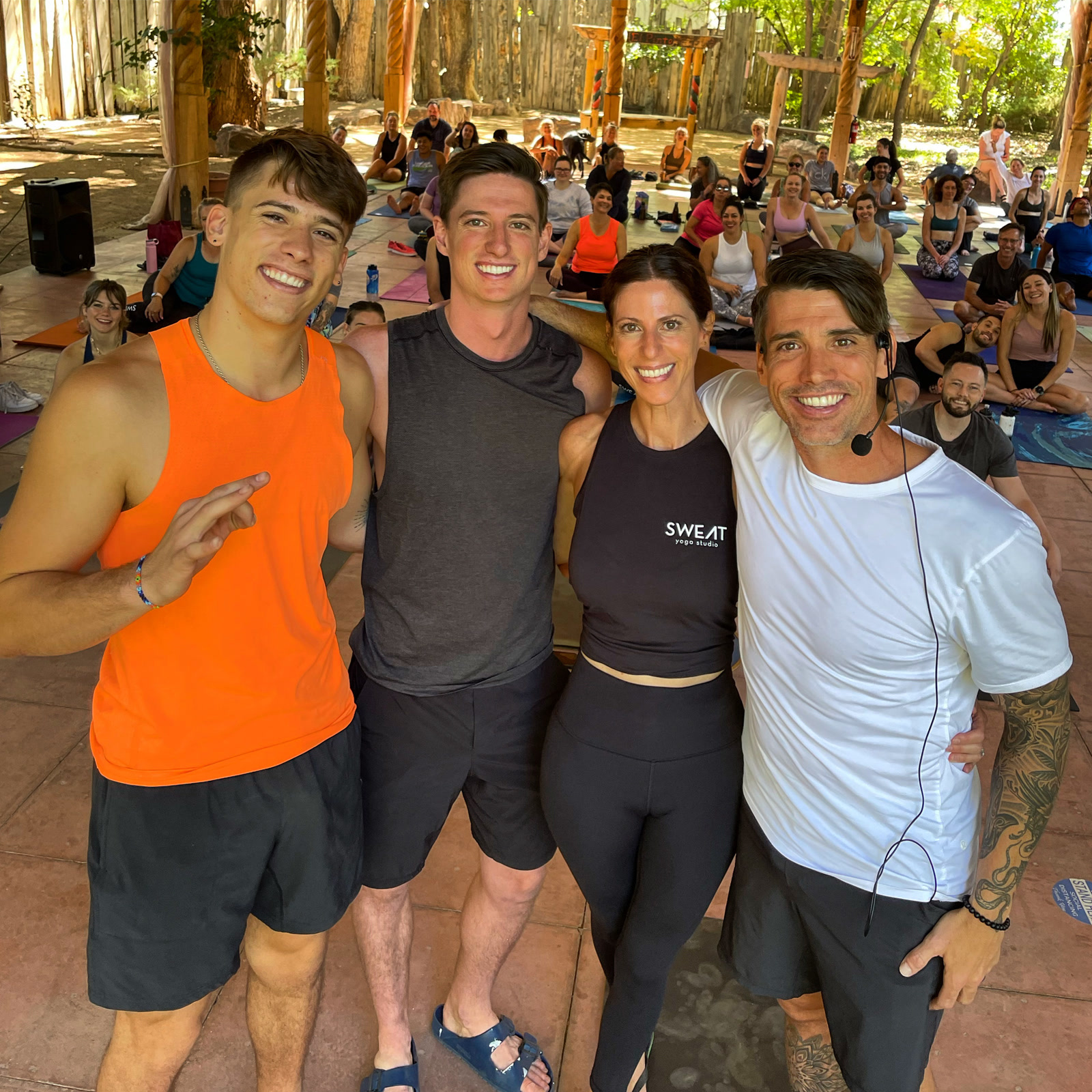 Marisa and David Johnson with their two sons at a SWEAT yoga retreat
