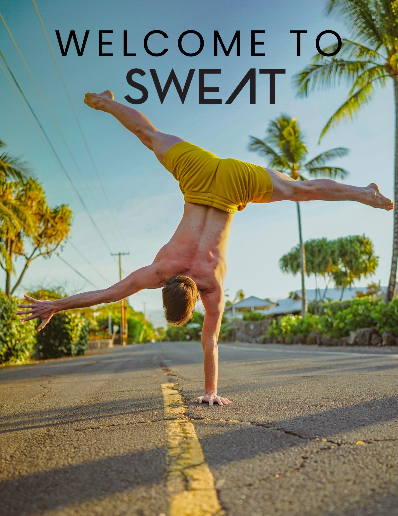 A one-arm handstand on an open road