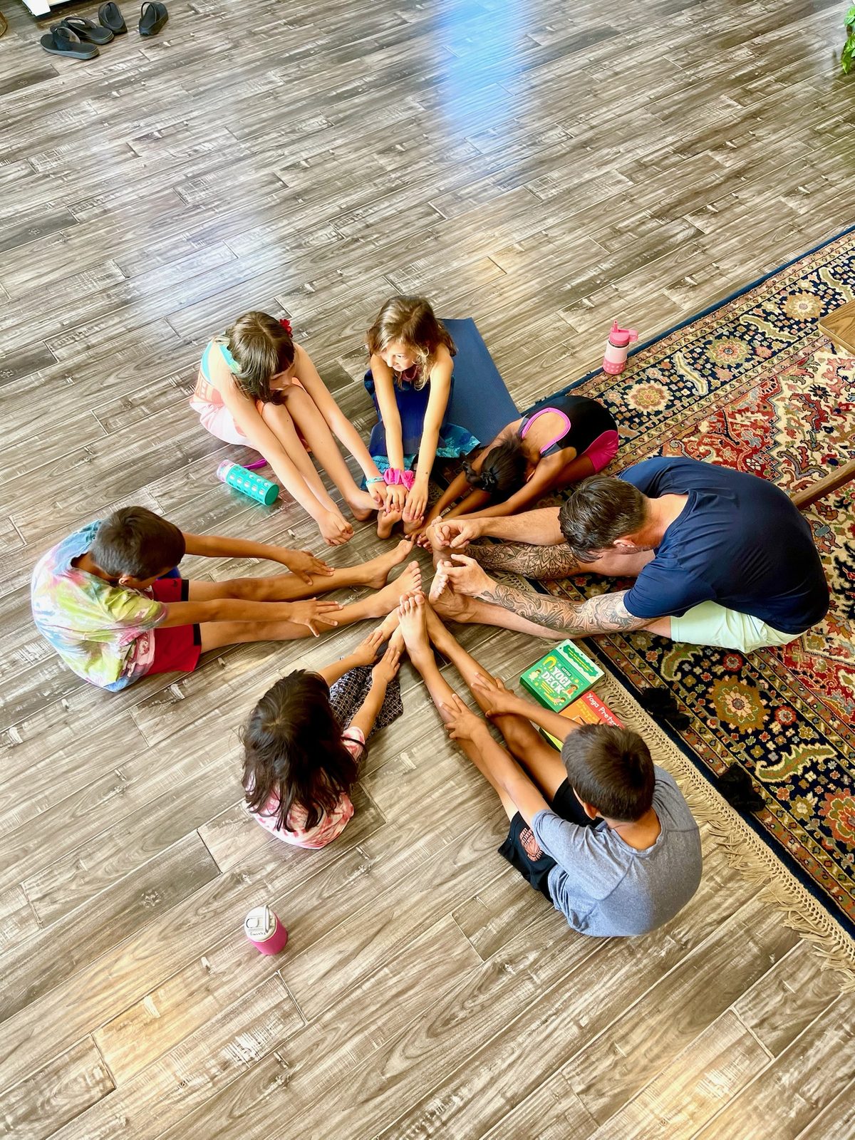 Kids in the on-site childcare room at SWEAT Yoga Studio